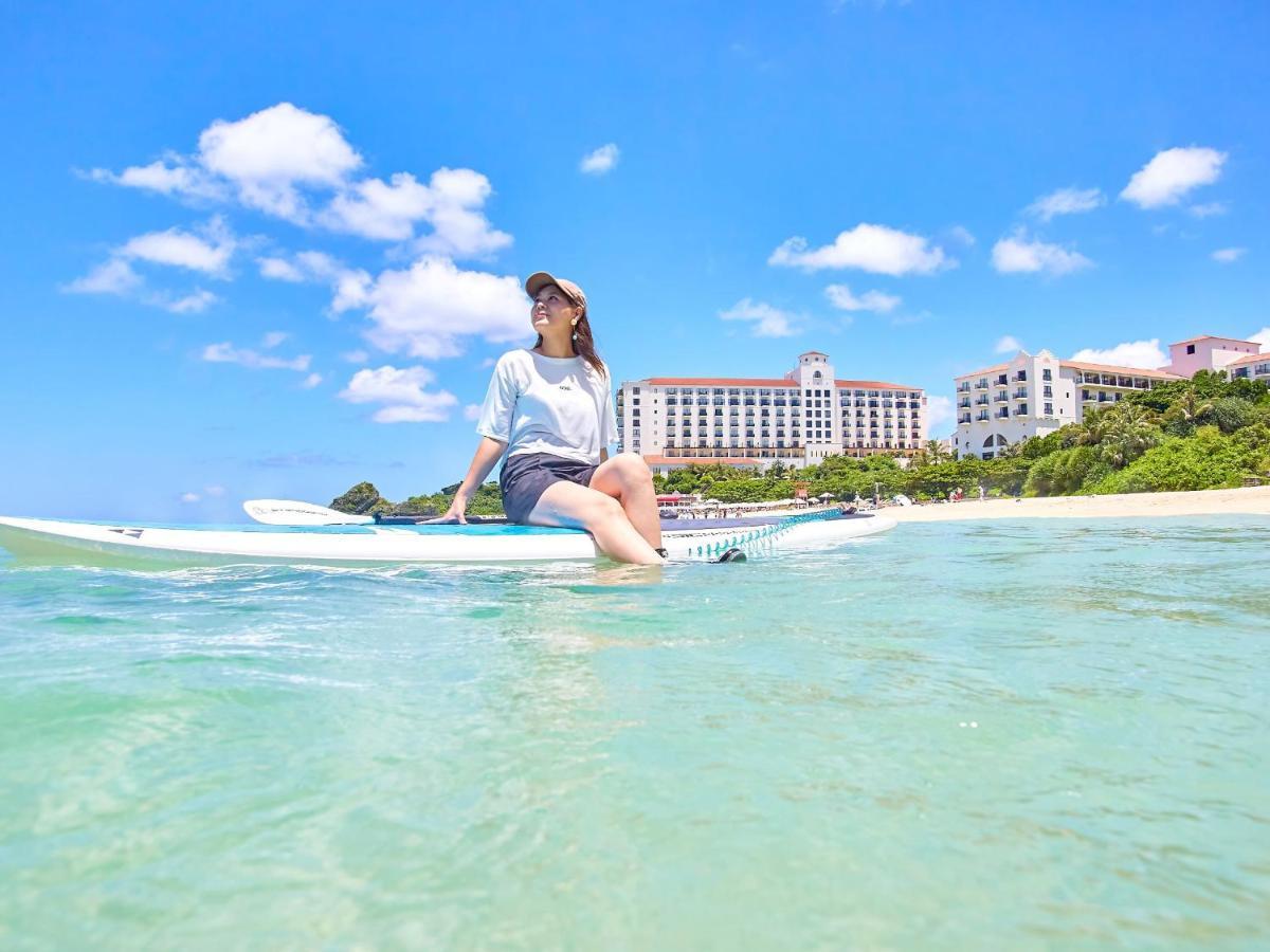Hotel Nikko Alivila Yomitan Exterior photo A woman on a stand-up paddle board in Okinawa, Japan