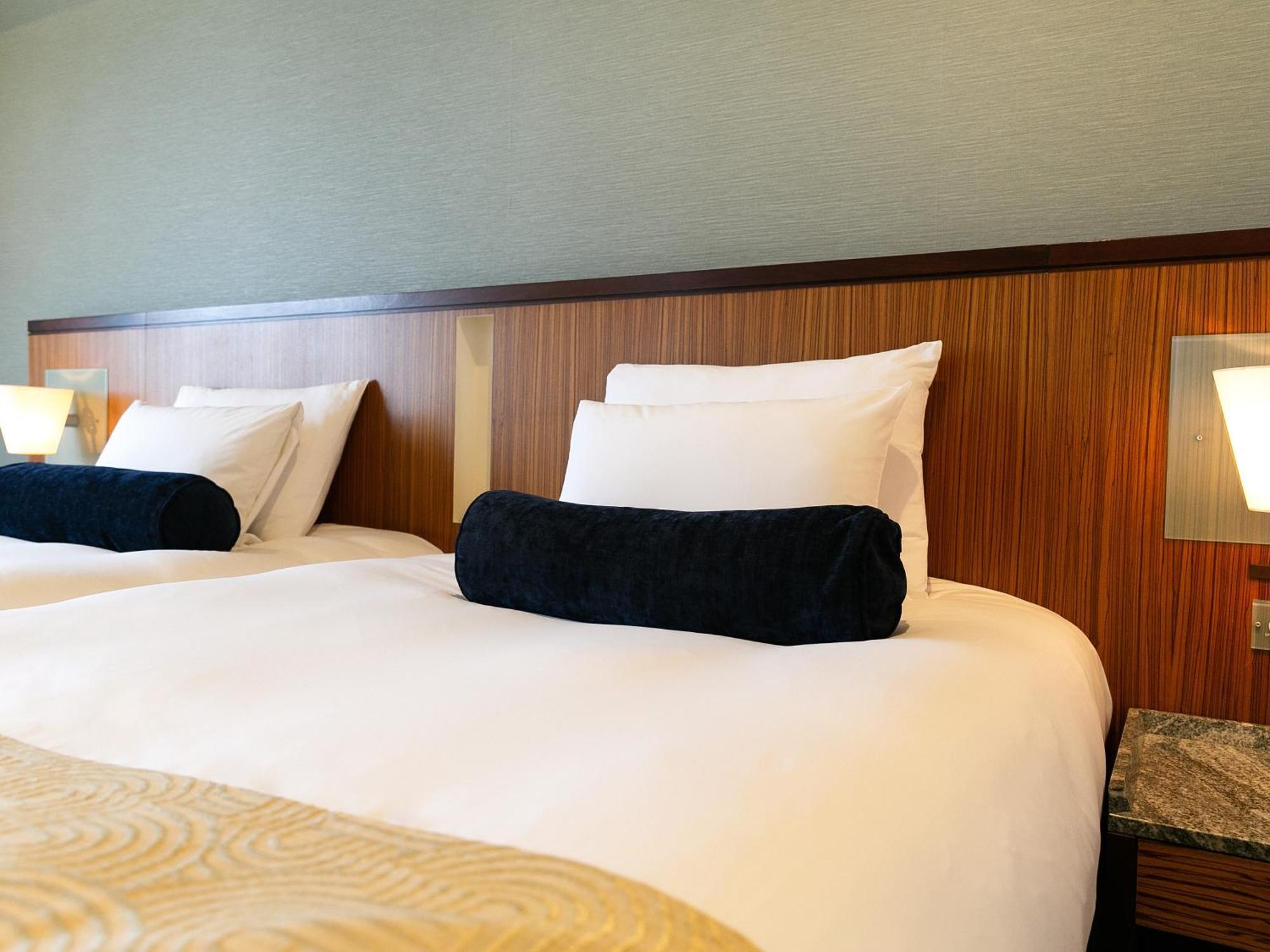 Hotel Nikko Alivila Yomitan Exterior photo A bed with a bolster